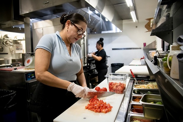 Cook Martha Garcia preps food in the kitchen at Verde Mexican Rotisserie in South Lake Tahoe on Oct. 6, 2021. Domi Chavarria, the owner of Verde Mexican Rotisserie, lost about $10K worth of inventory when they shut down for two weeks due to the Caldor Fire evacuation. - SALGU WISSMATH FOR CALMATTERS