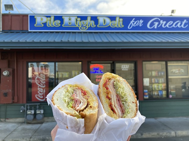 Pile High Deli’s muffaletta sandwich on Dutch crunch. - PHOTO BY JENNIFER FUMIKO CAHILL