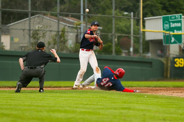 Crabs second baseman Mario DeMera steps on second base to make an out as he throws the ball over to first base for a double play against the Solano Mudcats on July 6. - THOMAS LAL