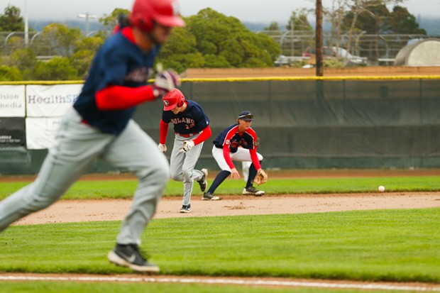 Crabs shortstop Cameron Saso makes a play on a ground ball as Solano Mudcats players run the bases around him at Arcata Ballpark on July 6. - THOMAS LAL