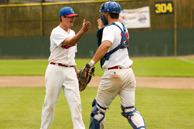 Crabs pitcher Caleb Ruiz celebrates throwing  a 2-0 complete game shutout against the West Coast Kings with catcher AJ Esperanza on July 17. - THOMAS LAL