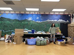 Magnolia Kelley, a Pay it Forward Humboldt volunteer, unloads supplies at Dream Quest in Willow Creek, which is providing supplies to fire evacuees. - ALLIE HOSTLER