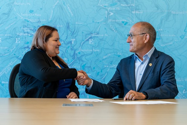 Yurok Tribal Heritage Preservation Officer Rosie Clayburn and California State Parks Director Armando Quintero sign historic agreement. - PHOTO COURTESY OF CALIFORNIA DEPARTMENT OF PARKS AND RECREATION