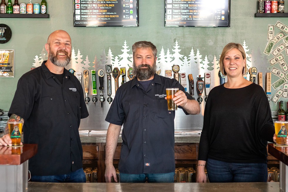 Ray Noggle, Neil Cheatum and Lisa Jennings behind the bar. - PHOTO BY RYAN MCGAUGHEY