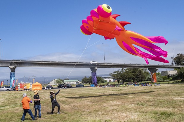 The festival team's airfoil kite takes flight. - PHOTO BY MARK LARSON