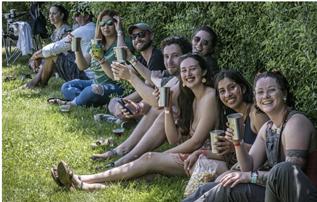 Revelers at last year's festival toast with their aluminum cups. - PHOTO BY MARK LARSON