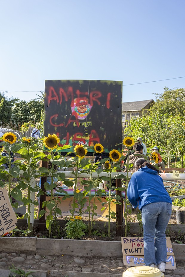 Community members gathered in a vigil against hate after the Jardin Santuario or Sanctuary Garden sign was vandalized in July 2022. - OLLIE HANCOCK