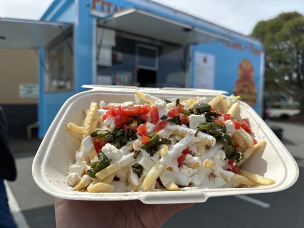 Loaded fries with tzatziki sauce. - PHOTO BY JENNIFER FUMIKO CAHILL