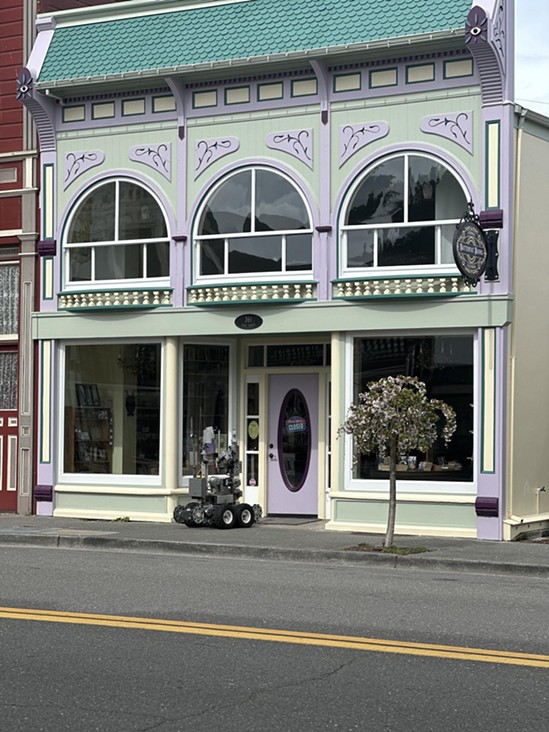 The Humboldt County Sheriff's Office bomb squad robot approaches the book store on Main Street. - SUBMITTED