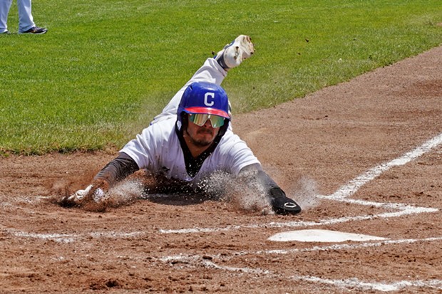 Victor Castaneda slides in safe at home during a high scoring day for the Crabs. - PHOTO BY MATT FILAR