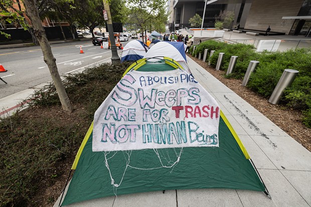 Tents outside the First Street U.S. Courthouse in Los Angeles, where homeless advocates and supporters rallied as the U.S. Supreme Court in Washington, D.C., heard oral arguments in the Grants Pass case, on April 22, 2024. - PHOTO BY TED SOQUI FOR CALMATTERS