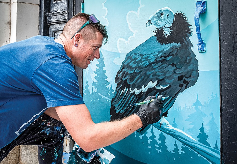 Mural artist Blake Reagan was adding the final details to "The Condor Returns" on this side entrance to the Clarke Museum. He has been involved in the Eureka Street Art Festival multiple times. - PHOTO BY MARK LARSON