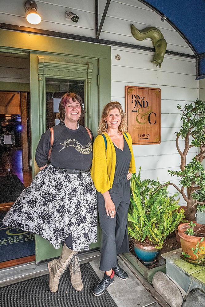 Ceramic artists Jessica Swan (left) and Shannon Sullivan led a walk through Old Town to view their "Slugs of Eureka" starting at the Inn at 2nd &amp; C, where the first of 16 larger-than-life slugs was installed. Sullivan is an artist faculty member in the Art Department at College of the Redwoods. Swan is her former student. - PHOTO BY MARK LARSON