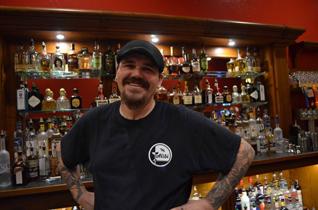 Bartender Stephen Shawles happily poured drinks from the new east-facing bar. - GRANT SCOTT-GOFORTH