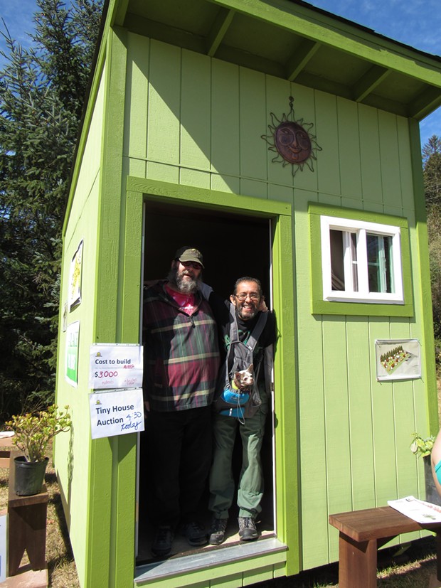 Carlos Hererra, Paul Lucas and their dog, Maybe, check out a tiny home. - LINDA STANSBERRY