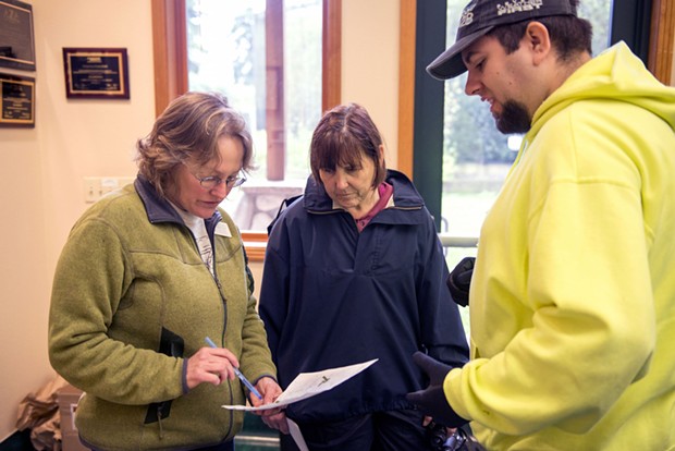 Sequoia Park Zoo Manager Gretchen Ziegler, left, talks with volunteers Jeanne Wielgus, of McKinleyville,  and Wesley Frietas, of Eureka, about the location of bamboo they had found in the search area he was assigned Saturday Morning. - MARK MCKENNA