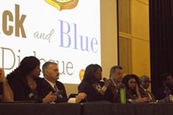 The 13 person panel at the Black and Blue Dialogue takes questions from audience members. - JAVIER ROJAS