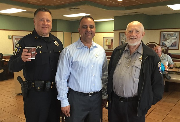 Longtime taxpayer advocate Leo Sears, far right, pictured at a Coffee with a Captain event, has died. - FACEBOOK
