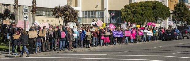 A crowd of more than 200 pro-choice and pro-Planned Parenthood supporters carry signs, chant and wave to passing drivers on Fifth Street outside the Humboldt County Courthouse on Saturday afternoon. - MARK LARSON