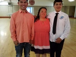 Lopez (right) with family in a photo on a crowdfunding page. - YOUCARING