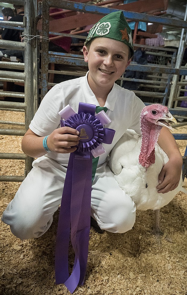 Rylan Lommori, of the Hydesville 4-H club, with his Grand Champion turkey. - PHOTO BY MARK LARSON