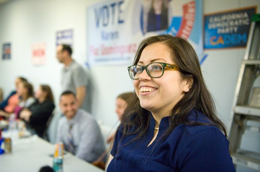 Karen Paz Dominguez flashes a smile as she watches the results come in. - MARK MCKENNA
