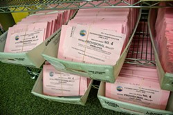 Bundles of provisional ballots wait to be vetted and counted in the Humboldt County Elections Office. - PHOTO BY THADEUS GREENSON