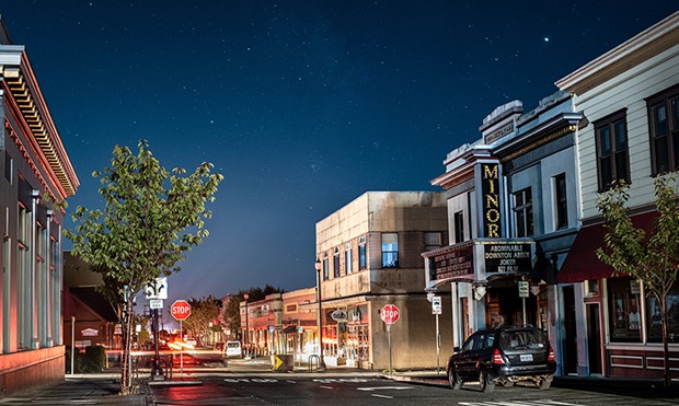 The historic Arcata Minor Theater bathed in moonlight beneath the stars during the PG&E power shutoff.