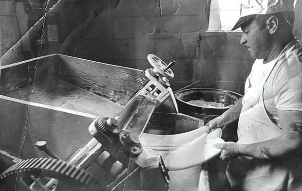 Gino Marcelli making ravioli with the same dough breaker machine the family business uses today.
