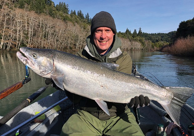 Ryan Parhaniemi, of Maple Valley, Washington, holds an 18-pound hatchery steelhead caught Jan. 9 on the Chetco River while fishing with guide Andy Martin of Wild Rivers Fishing. He was using a 3.5 MagLip plug.