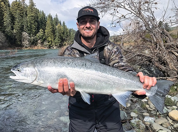Parker Lowe, of Yuba City, holds a wild steelhead he caught and released Feb. 20 while fishing the Smith River with guide Andy Martin of Wild Rivers Fishing. He was using a pearl-pink Corky and roe.
