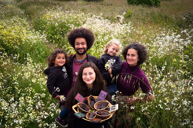 Elissa Verdillo and Zach Funk with their daughters, Solstice, Ominira and Mbeya.