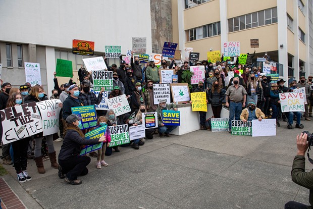 Participants in a Jan. 18 rally calling on the Humboldt County Board of Supervisors to repeal Measure S pose for a photo outside the courthouse.