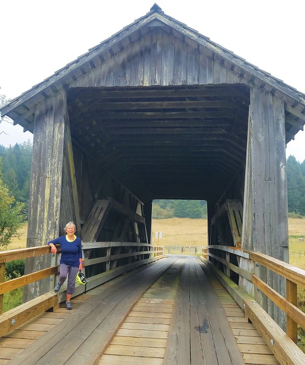 The author at a covered bridge on Elk River Road, not far from the Headwaters Forest Reserve.