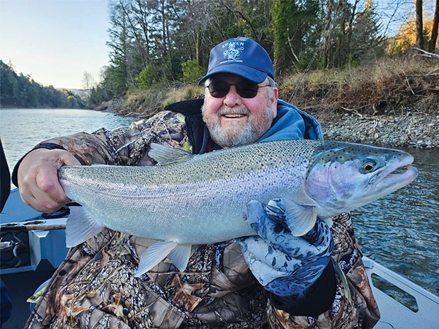 Don Williams, of Brookings, holds a hatchery steelhead caught a few days before Christmas on the Chetco River. The Chetco has been the best bet for winter steelhead this season.