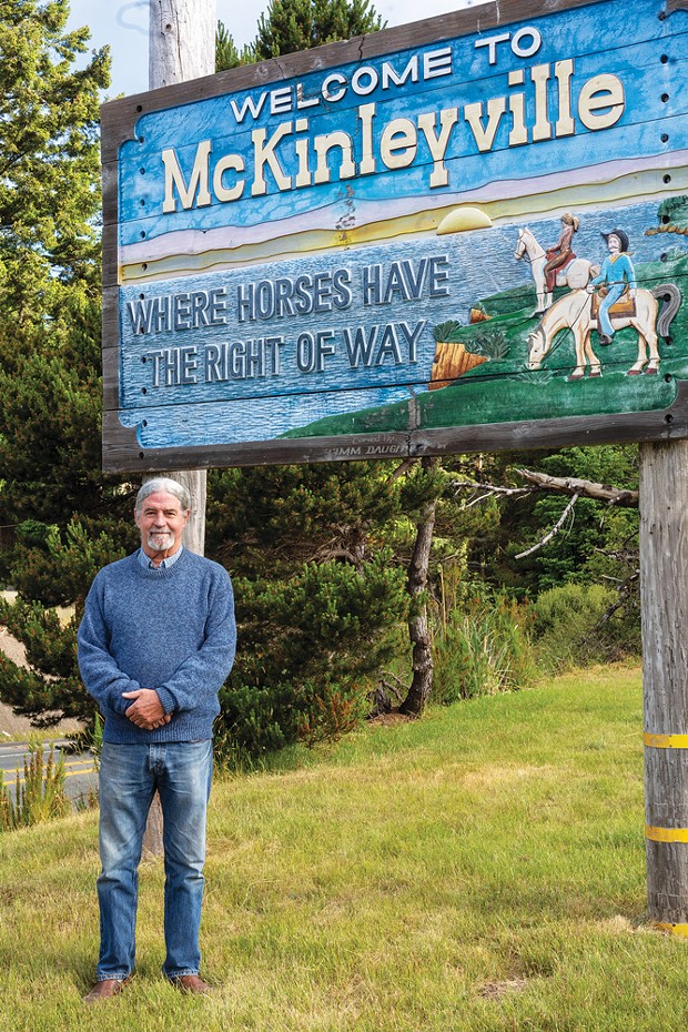 Fifth District Supervisor Steve Madrone stands at the McKinleyville sign.
