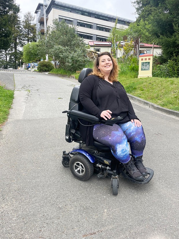Christine DiBella in her power chair on the CPH campus.