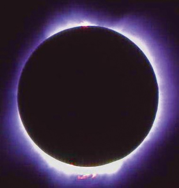 A photo of the July 11, 1991, solar eclipse. Note the pink plasma "prominences," hot gases of electrically charged hydrogen and helium.
