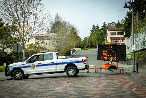 An Arcata police truck blocks access to the center of the Cal Poly Humboldt campus.