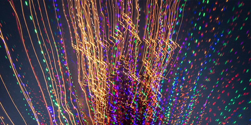 Woodley Island Walkabout Slideshow This is a special camera-exposure effect from zooming in or out while using a slow shutter speed while looking at the Commercial Fishermen's Wives' lighted "tree" made out of dozens of crab pots. The Christmas tree's star faces out towards Humboldt Bay to welcome home the fishing boats and crew. Photo by Mark A. Larson