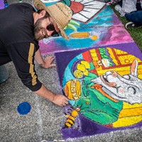 Pastels on the Plaza 2022 Chalk artist Lucas Thornton paused work on his familiar GOAT panel artwork for sponsor Cypress Grove. Photo by Mark Larson