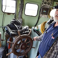 The 1091 Don Reed takes the wheel — but adds that the bridge has been outfitted with modern engine and steering equipment. Grant Scott-Goforth