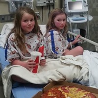 A picture of Leia and Caroline at the hospital on their family's GoFundMe page.