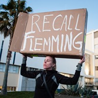 Aunna Bowllmann holds a sign in front of the Humboldt County Courthouse yesterday, protesting a criminal grand jury's decision not to indict anyone in the unsolved killing of David Josiah Lawson.