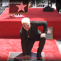A screenshot of Guy Fieri and his star.