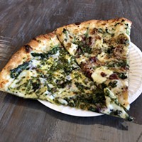 Pizza with pesto and brie in Trinidad.