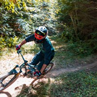 A rider takes on a drop and prepares for another on the trail through Green Diamond property a day ahead of the Mad River Enduro race.