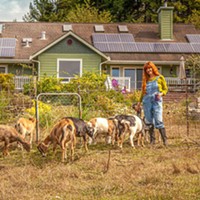 Karin Eide at the farm, in front of the solar-powered cheese-making facility.