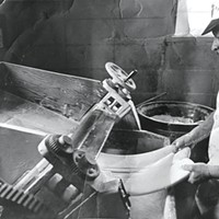 Gino Marcelli making ravioli with the same dough breaker machine the family business uses today.