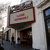 A sign outside of the Stanford Theatre announced its temporary closure in downtown Palo Alto on March 4, 2020.
